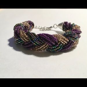 Gold and amethyst color beaded bracelet.